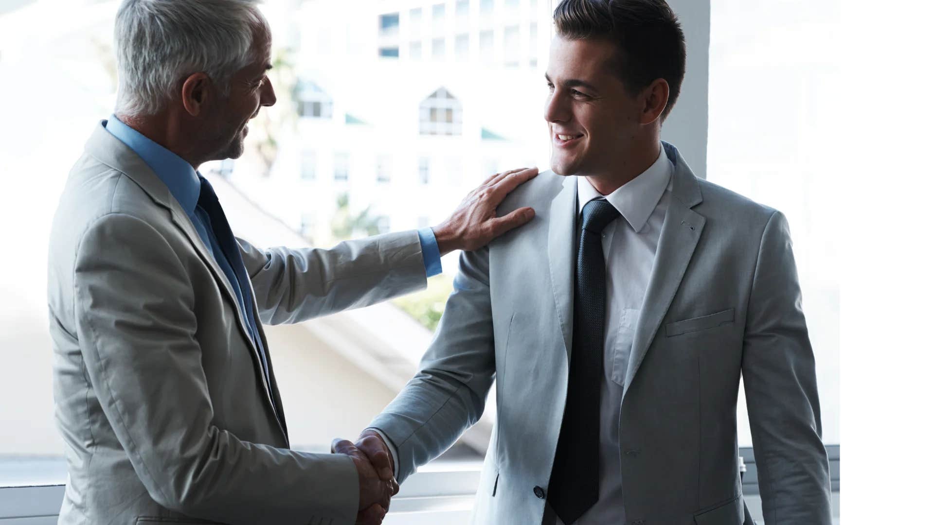 man walking into a store shaking man's hand and talking to manager for a job
