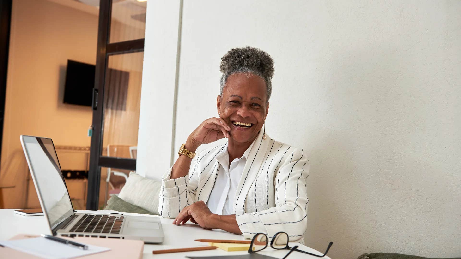 older woman stuck in the 20th century joking saying workin' hard or hardly workin'