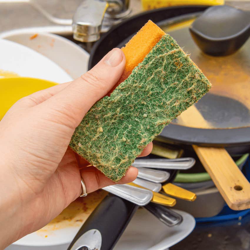 person cleaning using old kitchen sponges