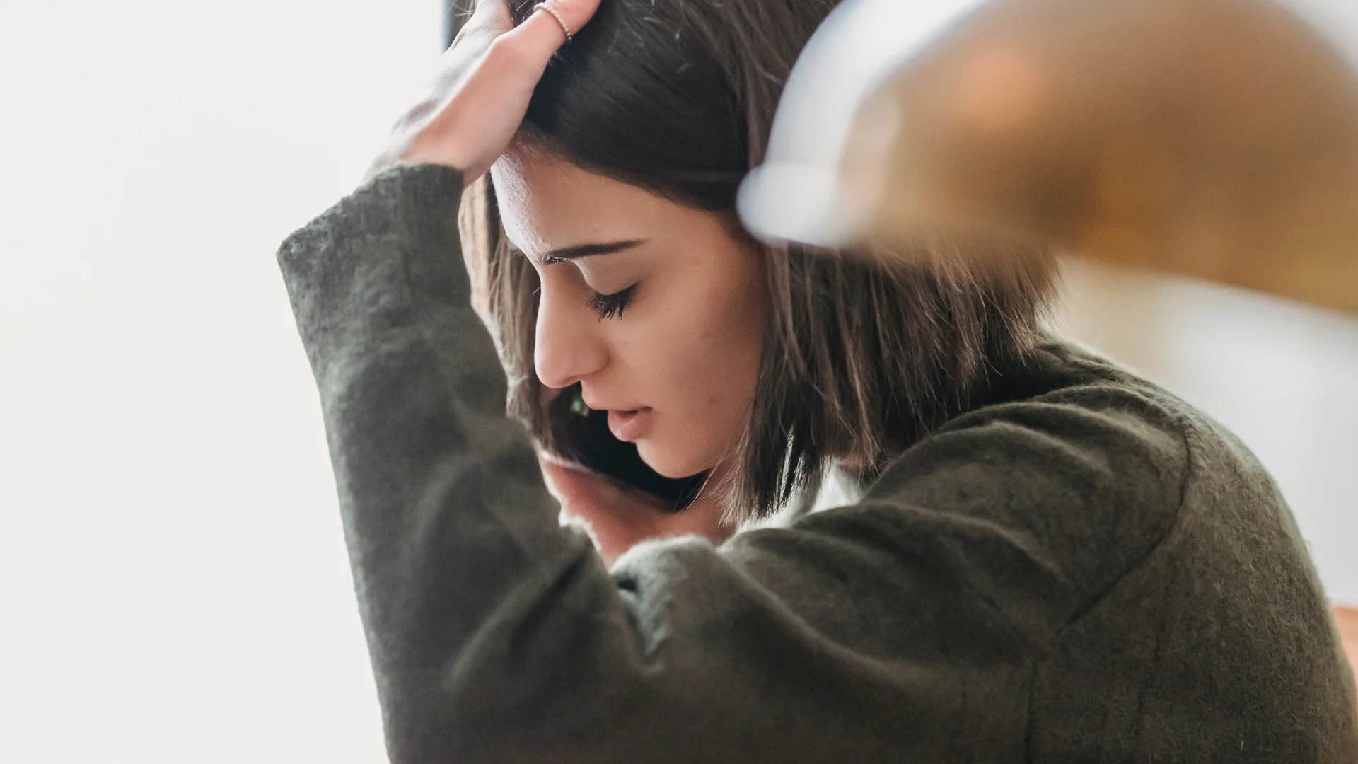 woman settling in her relationship on phone saying at least they don't beat me or cheat on me