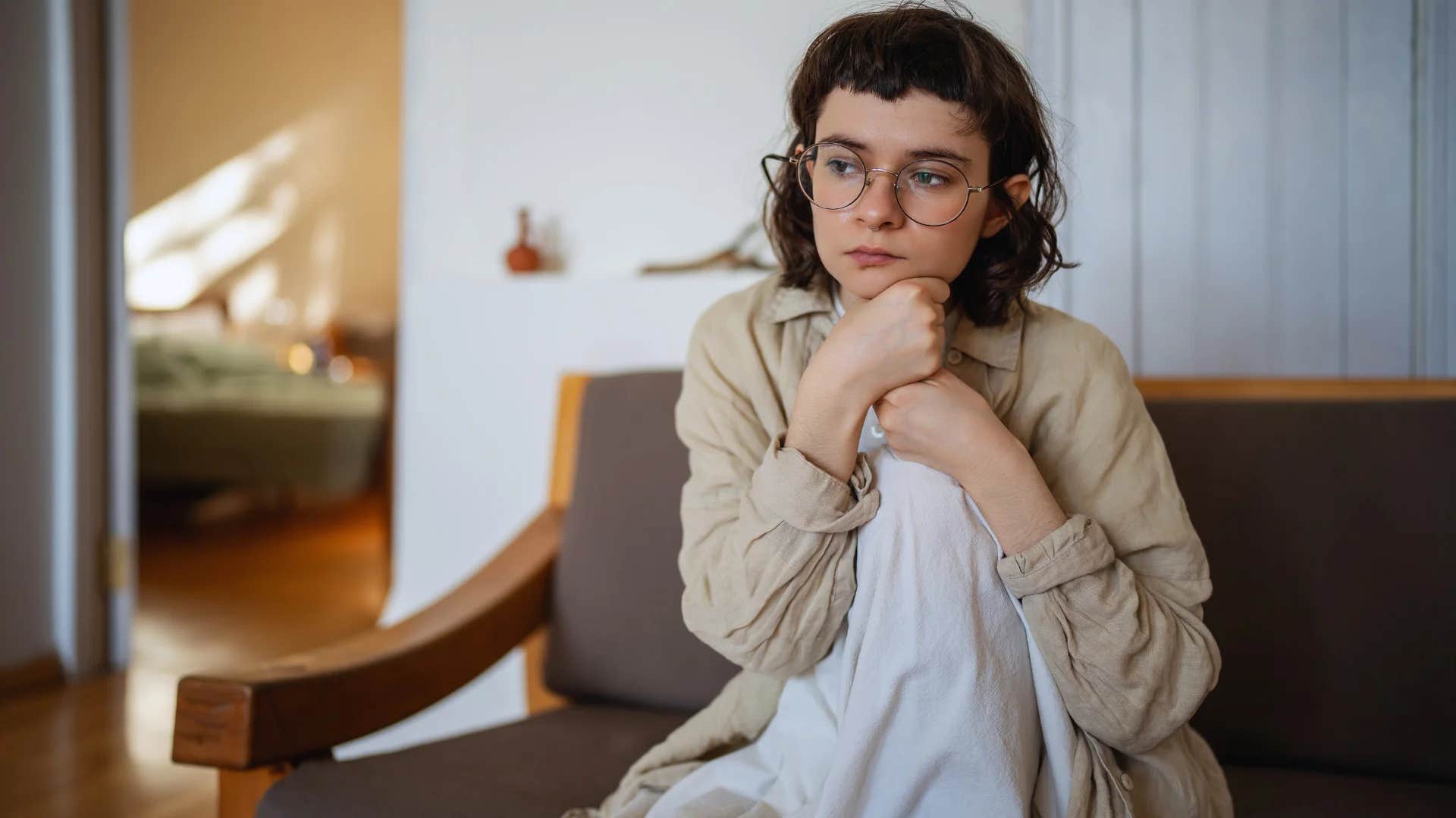 woman settling in her relationship thinking to herself i don't believe in soulmates anyway