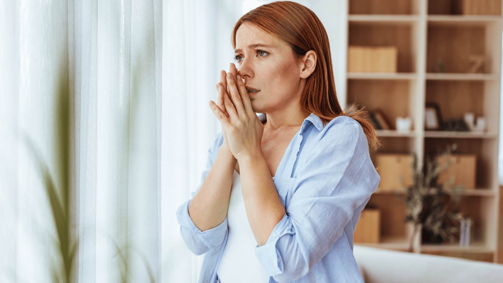 woman in white shirt scared as she thinks i'm just not ready yet