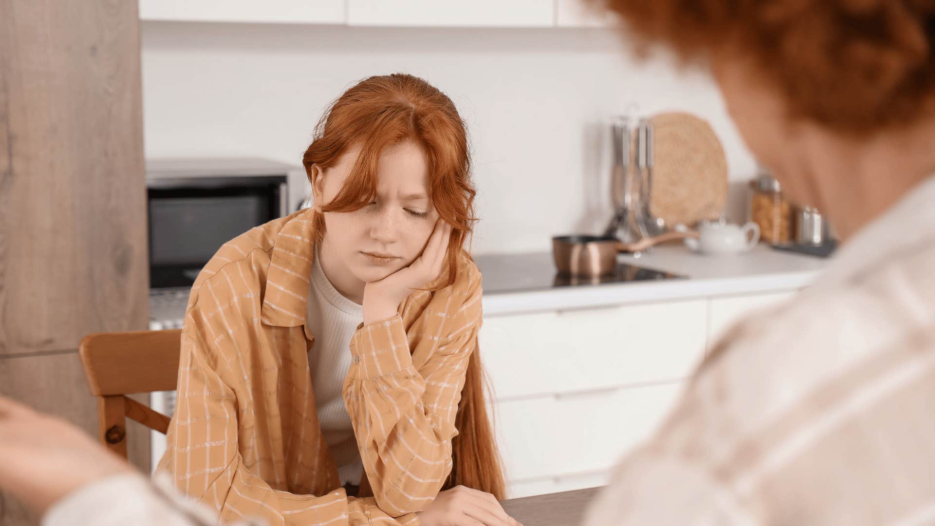 teenage daughter with red hair being expected to forgive family members without ever receiving an apology