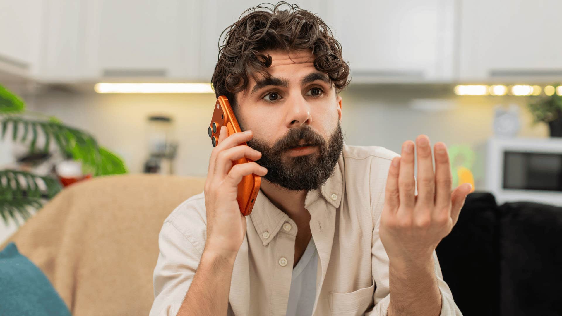man in white shirt on the phone annoyed as he says everyone is so sensitive nowadays