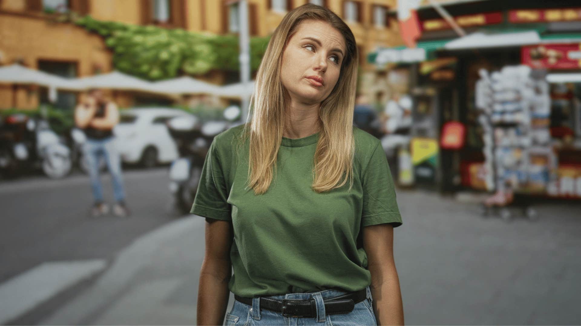 woman in green shirt rolling eyes as she says must be nice