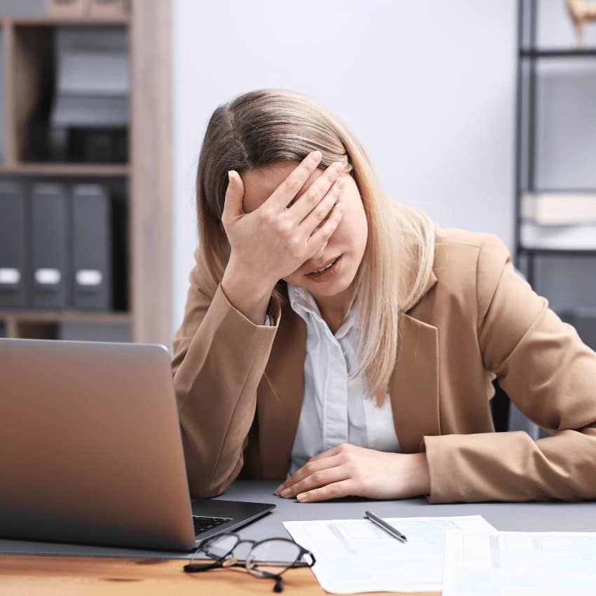 woman getting taken advantage of at work by boss setting deadline she can't meet