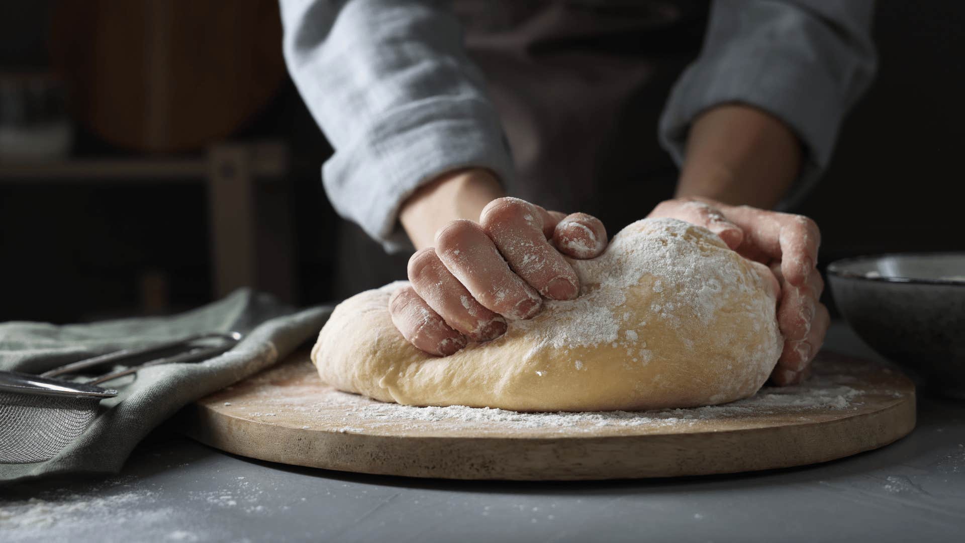 person baking homemade sourdough bread