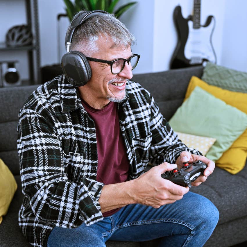 happy man playing a video games after a really rough week