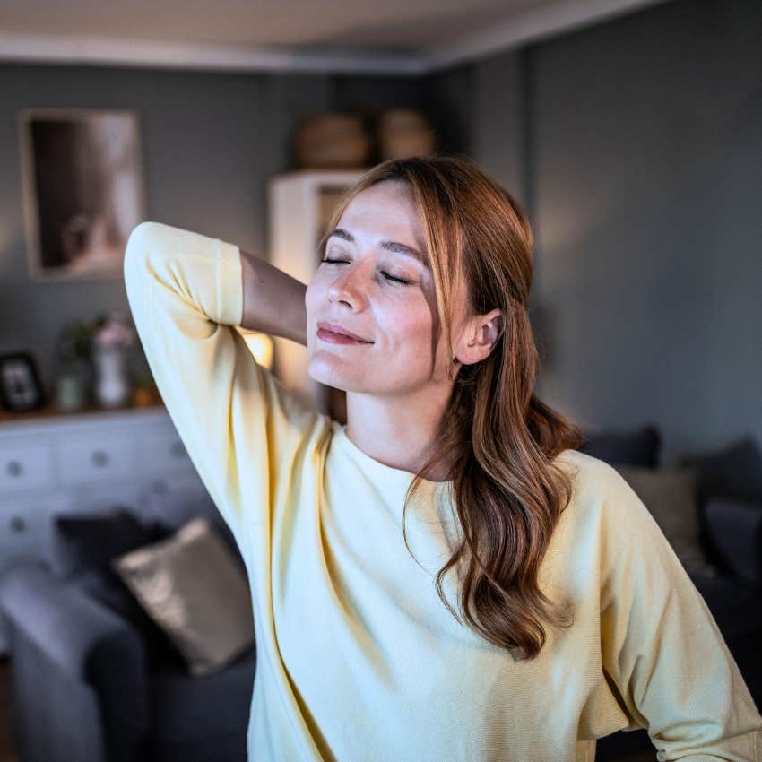 woman stretching to calm down after a rough week