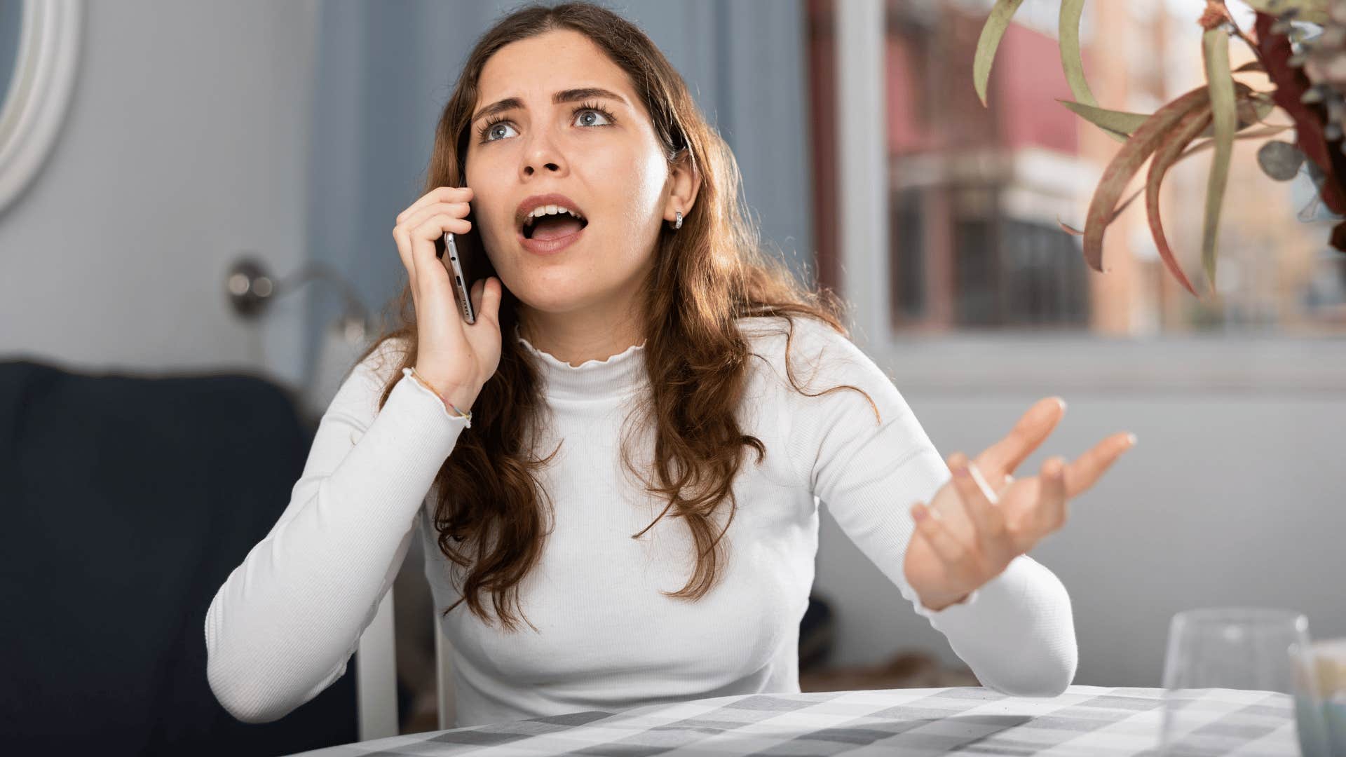 woman on the phone saying if you have something to say say it to my face