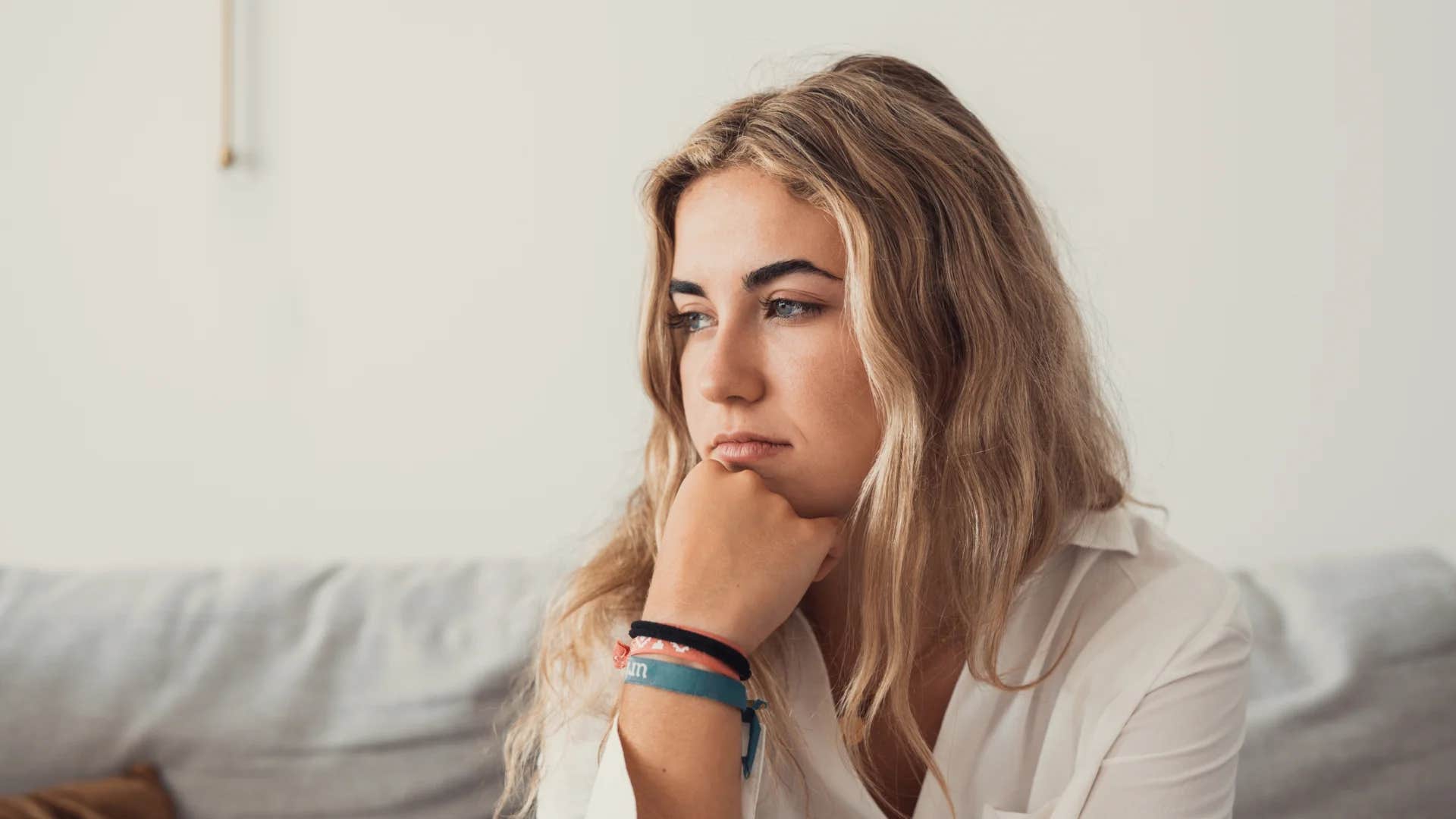 young woman making herself more miserable than she needs to be telling herself it's not fair that good things happen to other people but not to me