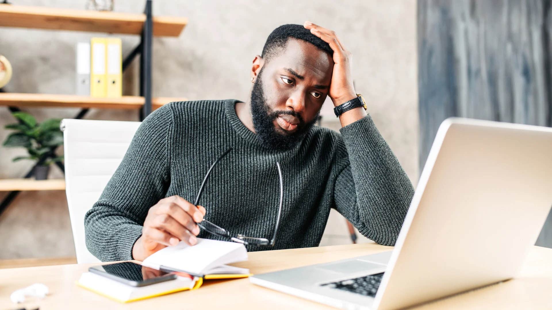 young man making himself more miserable than he needs to be telling himself i'm not happy in my career