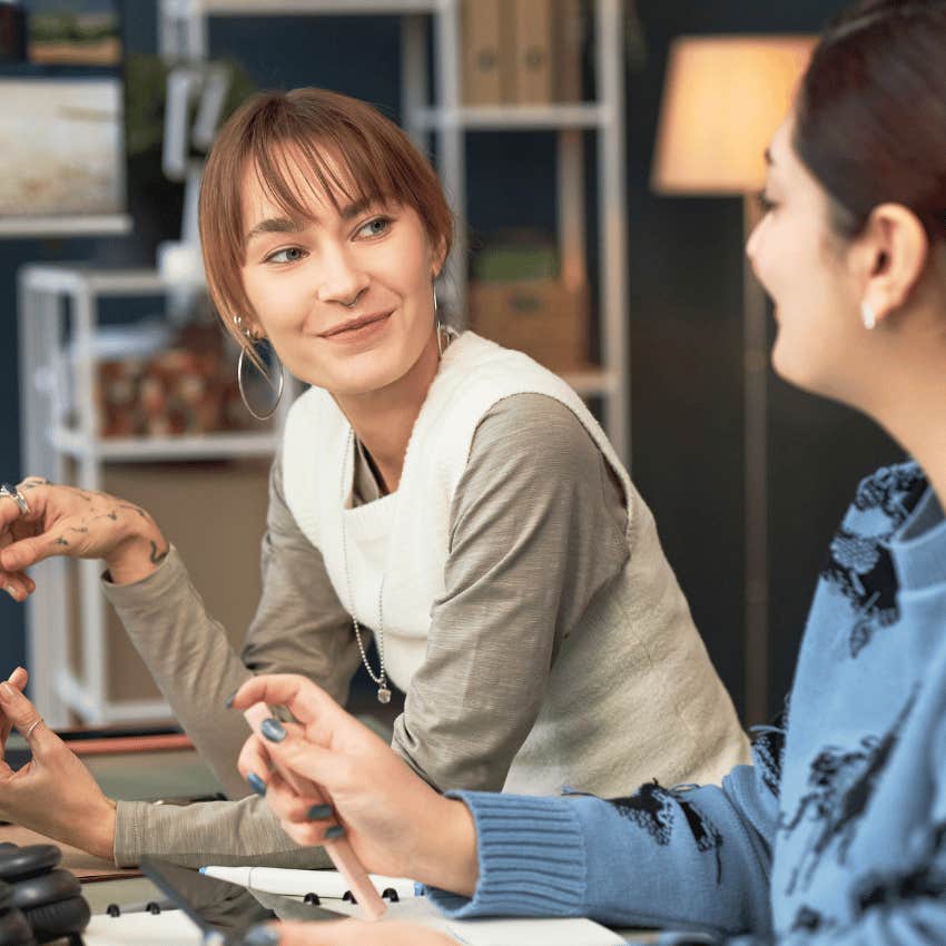 woman with natural confidence staying interested with colleague