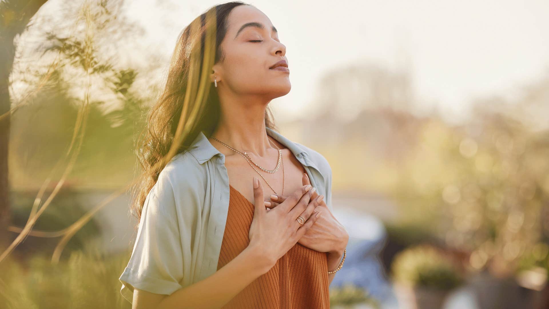 woman meditating outside 