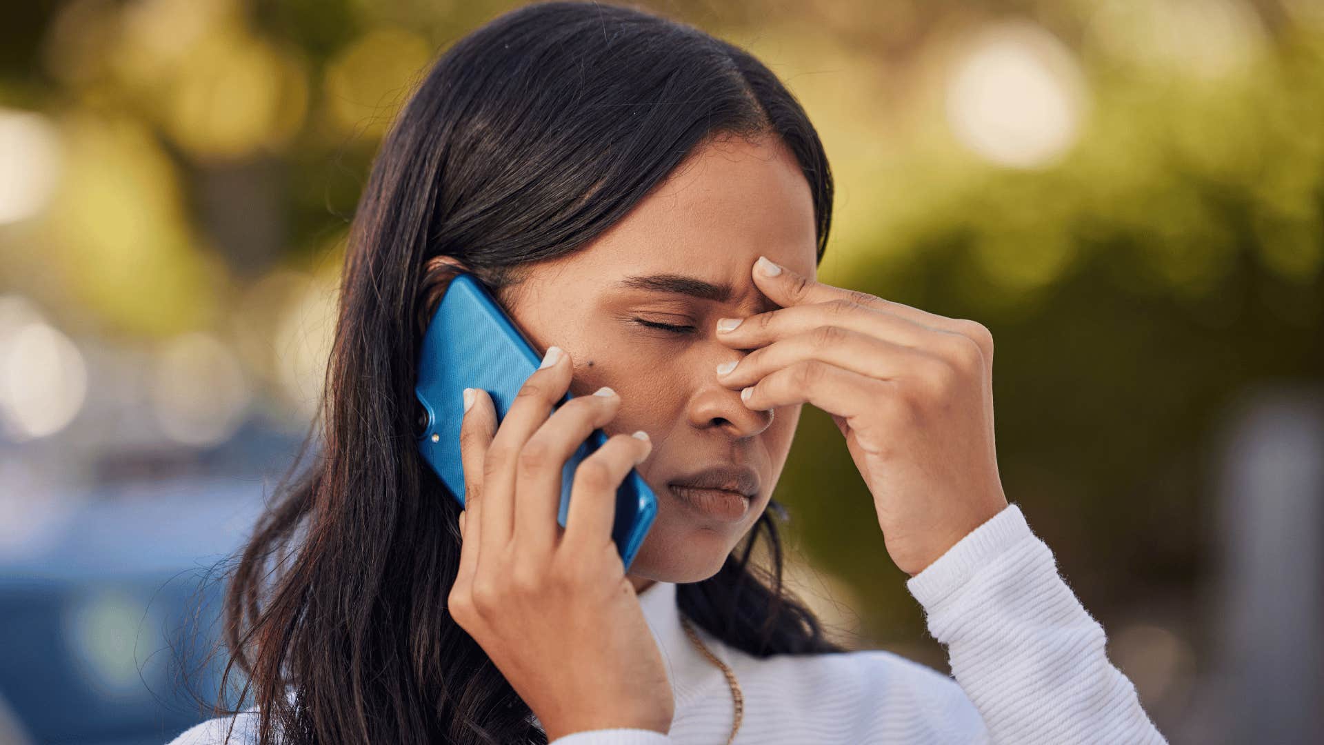 woman frustrated on the phone as she says that's not even worth discussing