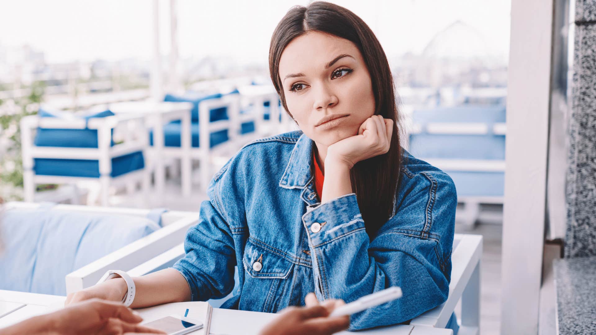 woman in jean jacket saying there's no point in arguing with you