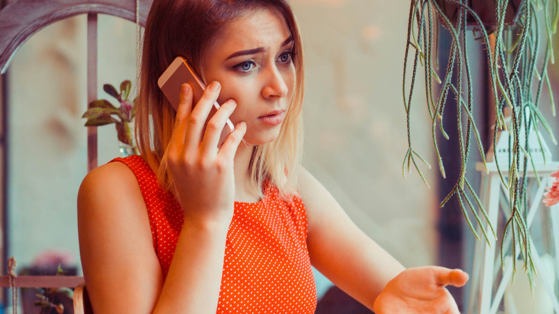 woman telling a friend she's in the middle of something