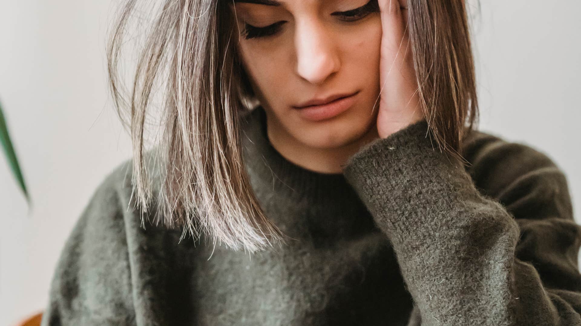 woman looking at her phone thinking it could have been an email