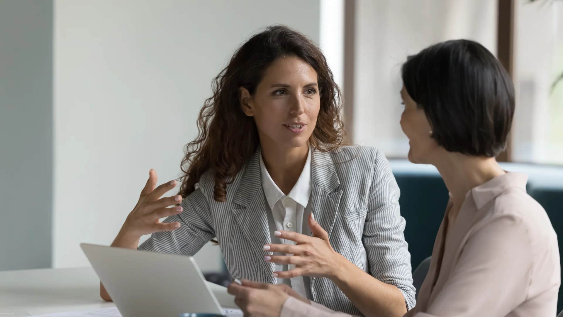 woman stuck in the 20th century telling colleague you're so articulate