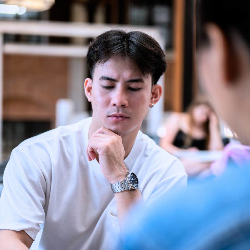 man trying to be happy saying no I'm fine" to a friend