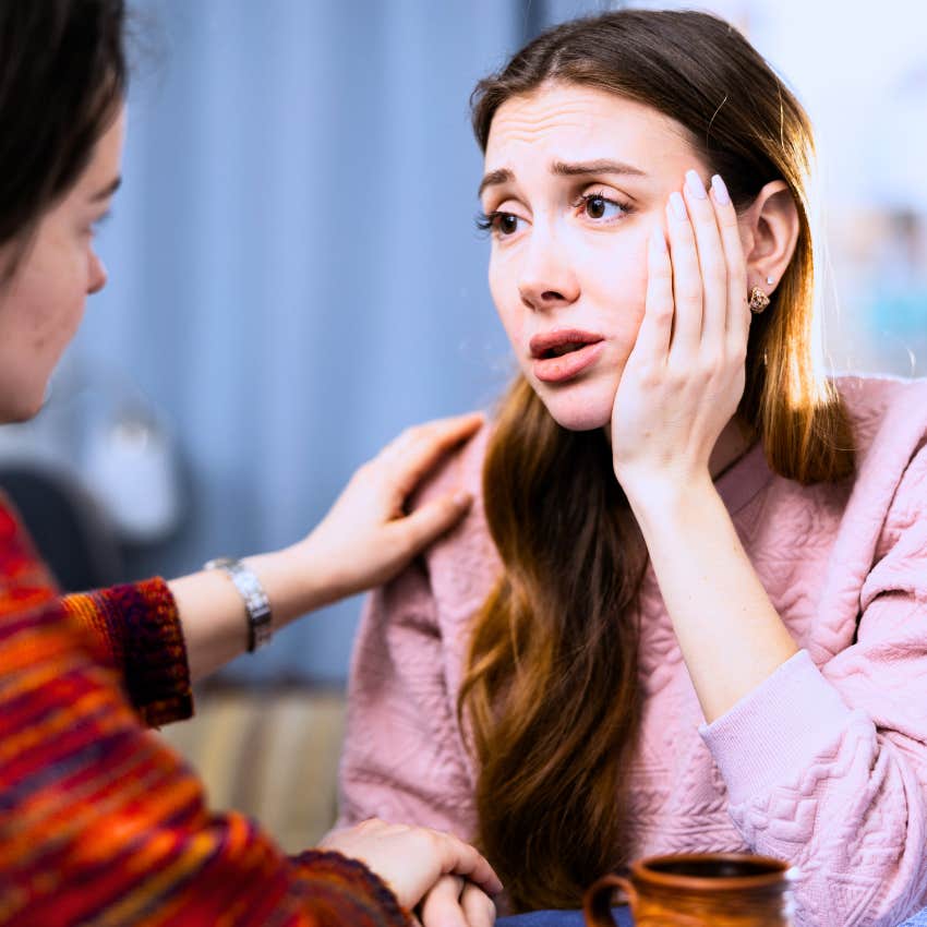 unhappy sad woman being comforted by friend and telling her why wouldn't I be happy