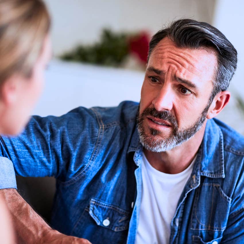 unhappy man talking to partner asking why is this happening