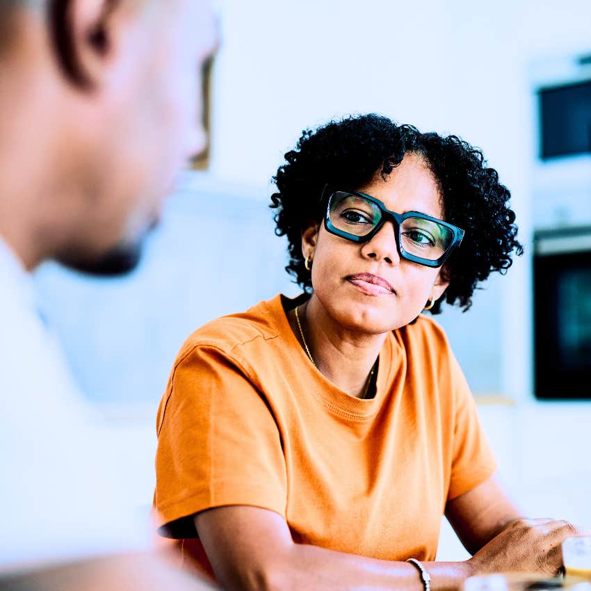 confident woman focusing on colleague's actions over their words