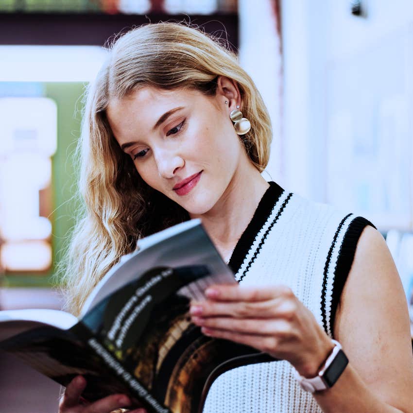 woman who has boundaries with her phone reading a book instead