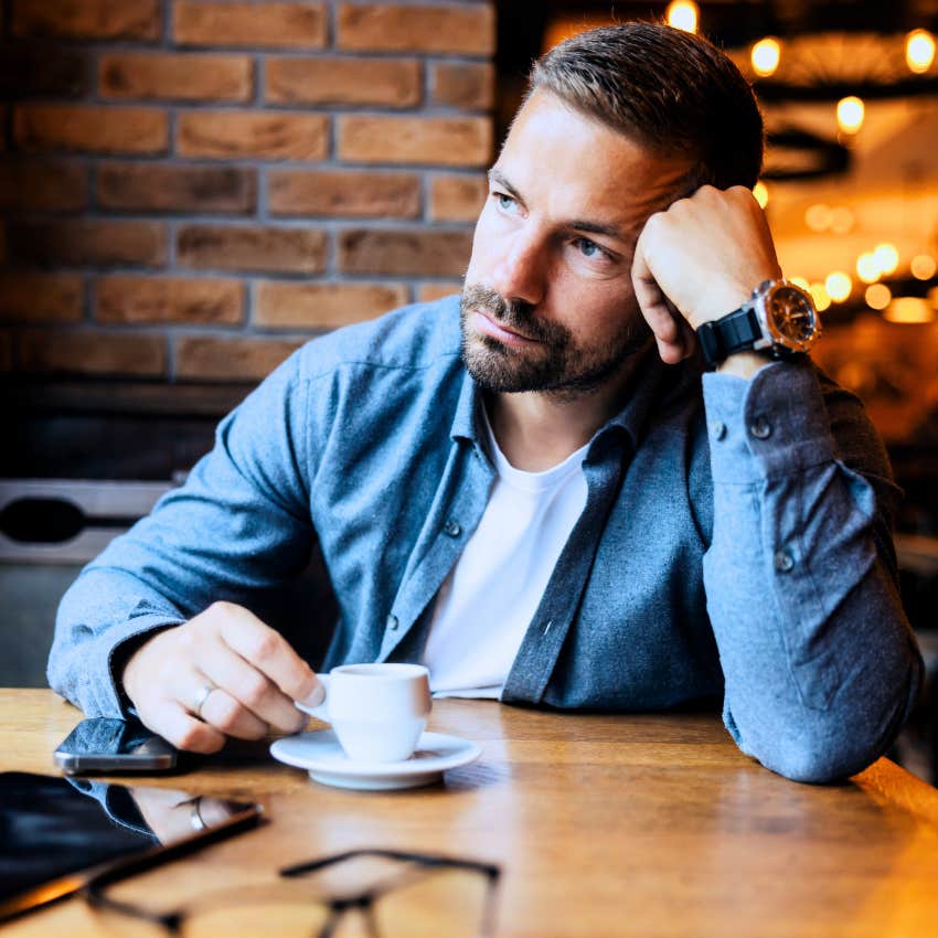 socially intelligent man observing his surroundings at a cafe