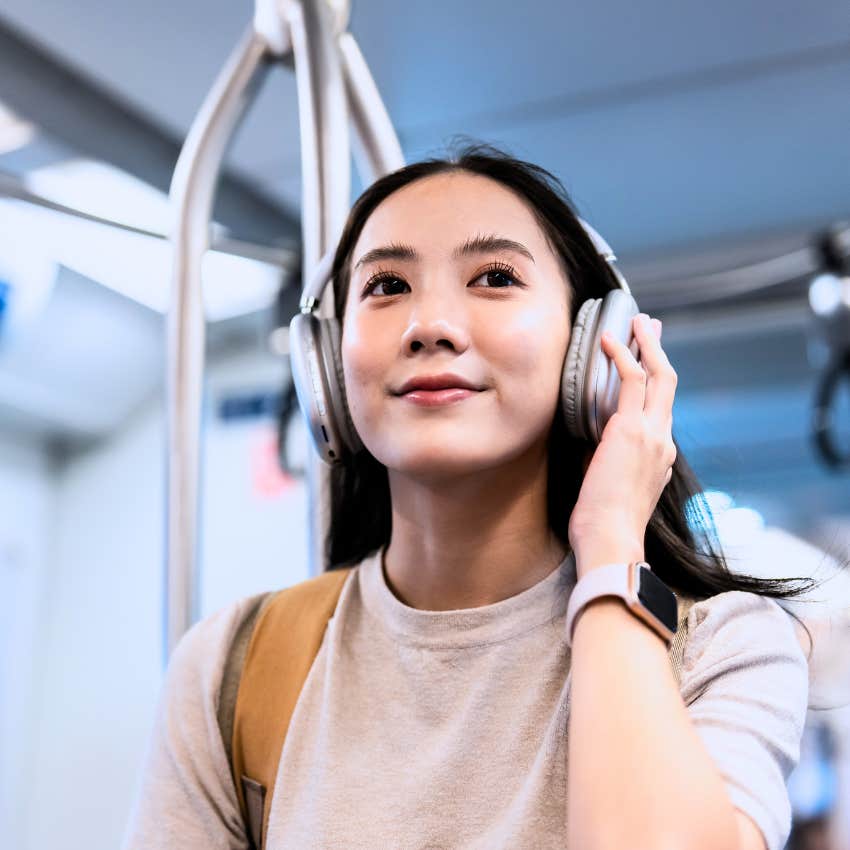 socially intelligent woman respecting etiquette on the bus listening to music
