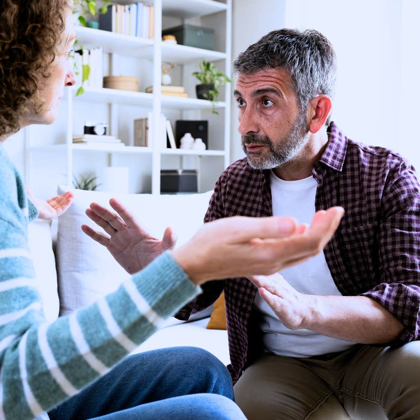 Man in a toxic or draining relationship being distracted at home.