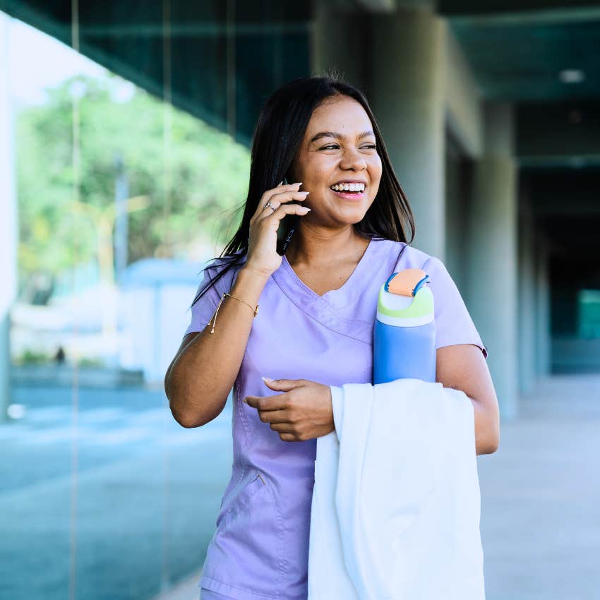 energetic young woman walking to work to burn off energy