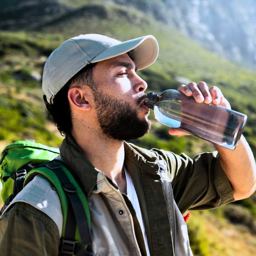 man hiking outside in nature to burn extra energy