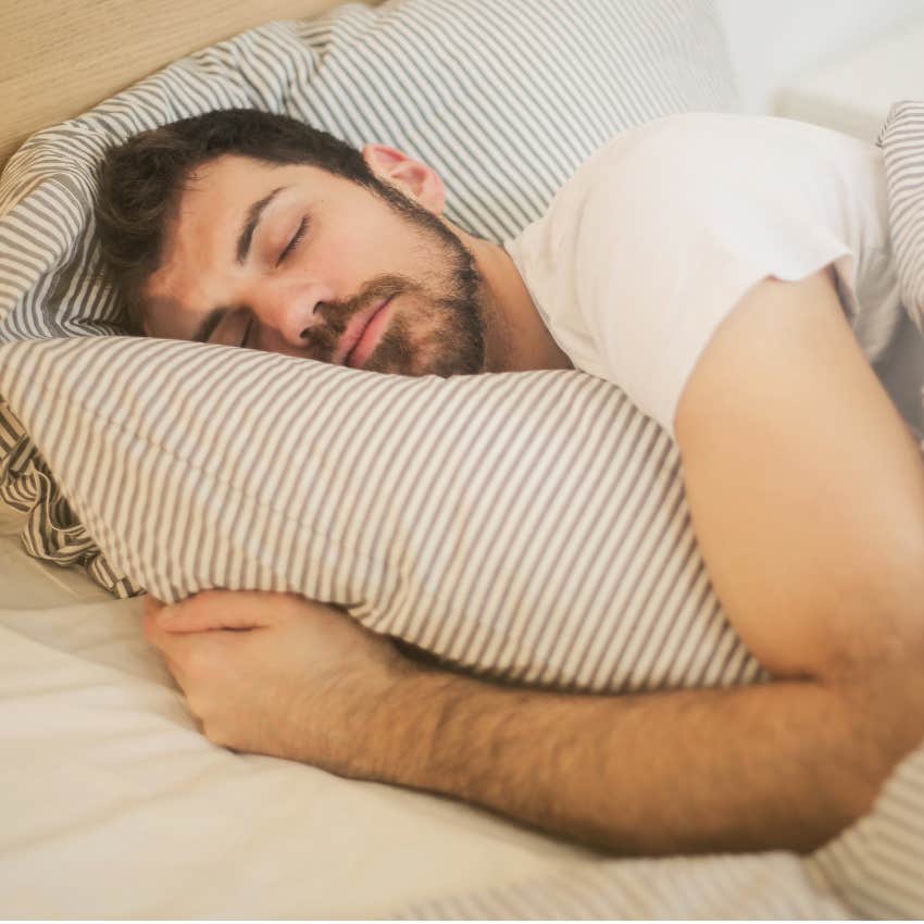 man sleeping in an extra hour when daylight saving time ends