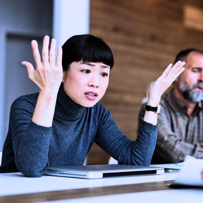 annoyed woman telling incompetent workers we're not getting anywhere