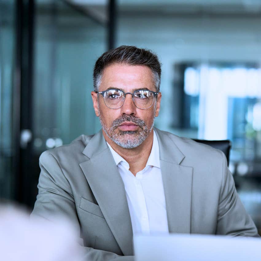 irritated man asking why are we overcomplicating this at work
