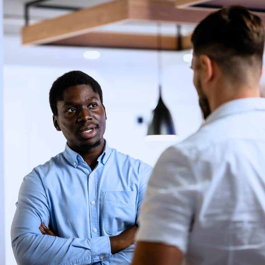 man irritated by incompetence telling colleague you should figure that out