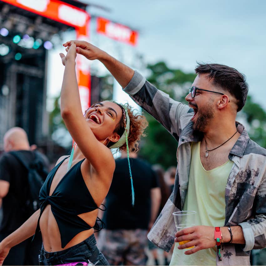 couple at a concert dancing and having fun