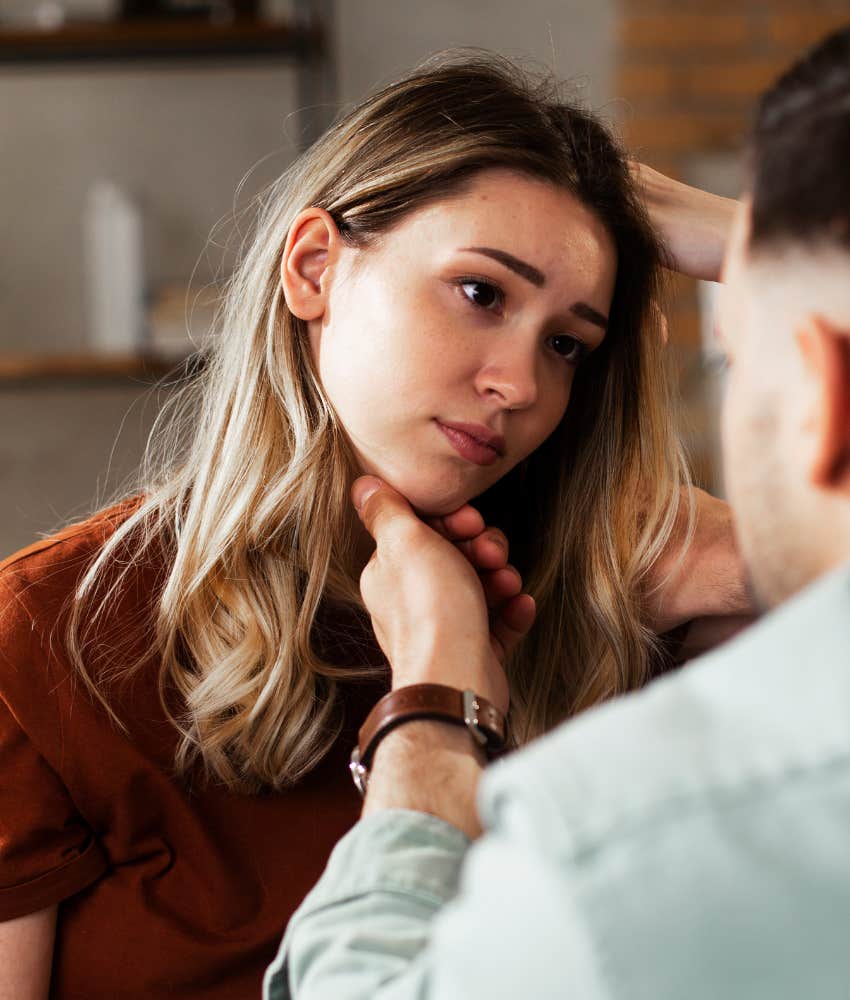 young woman being comforted and looking sad and lost