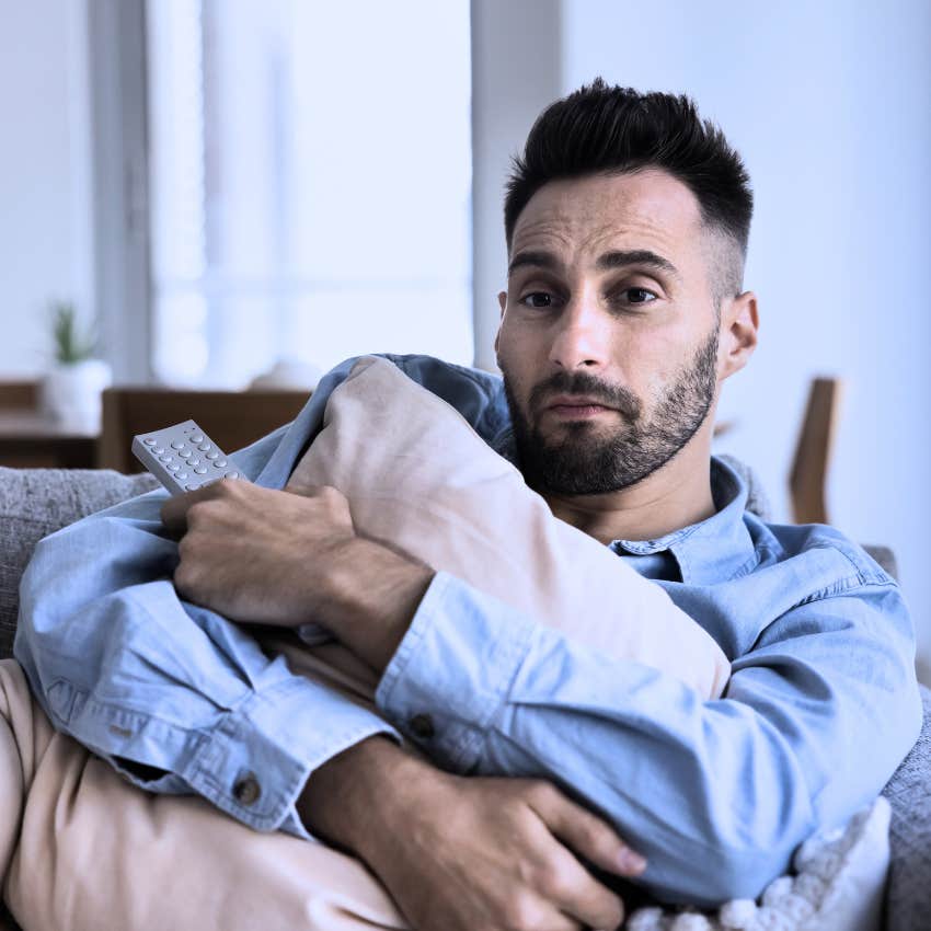 Sad man retreating to a predictable environment by watching the same show
