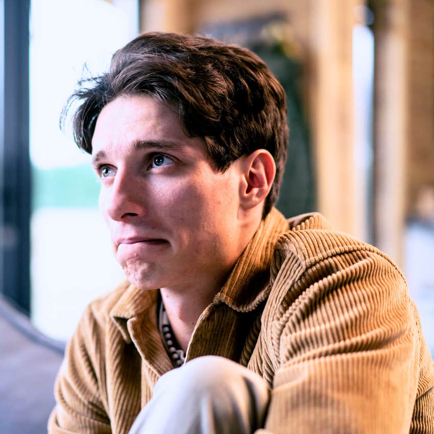 Sad man seeking out media that heals a wound at home