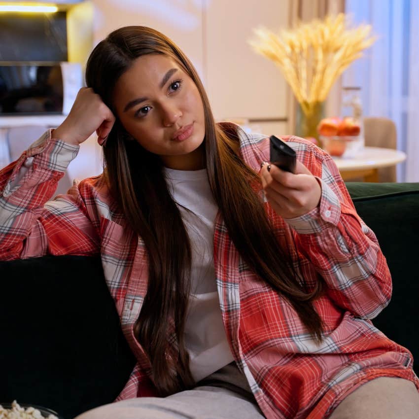 Woman using a TV show as a healthy distraction when she's sad