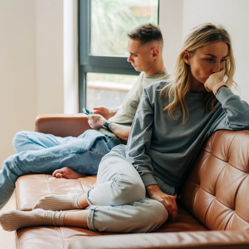 woman who doesnt even want to try sits facing away from a man 