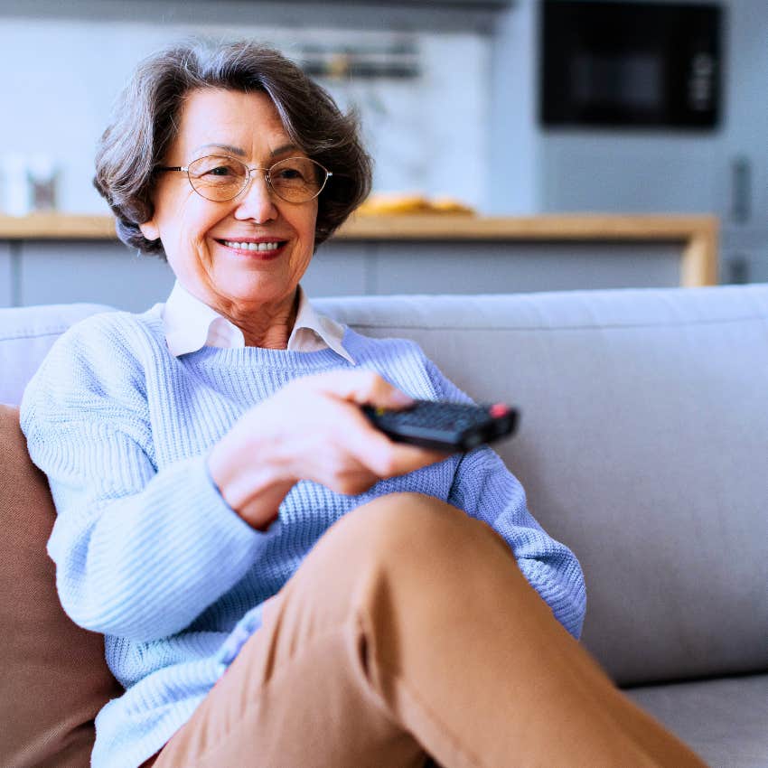 Woman using outdated cable TV in their homes.