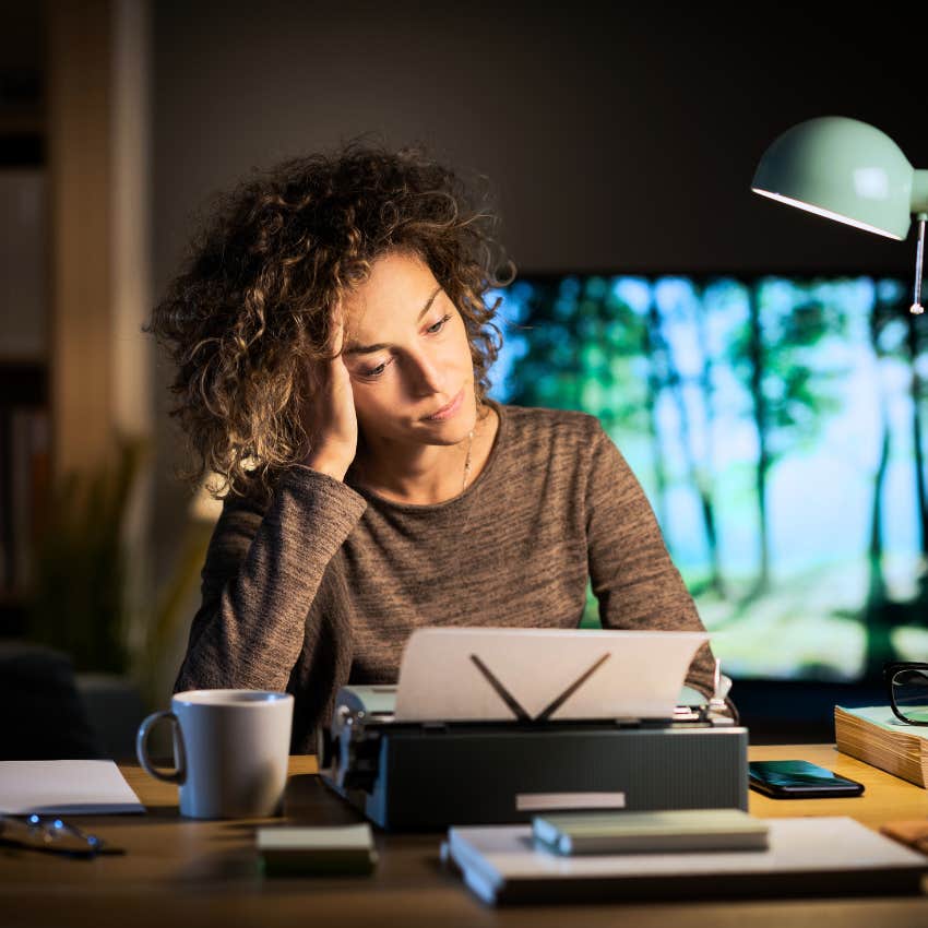 Woman using a typewriter in their homes.