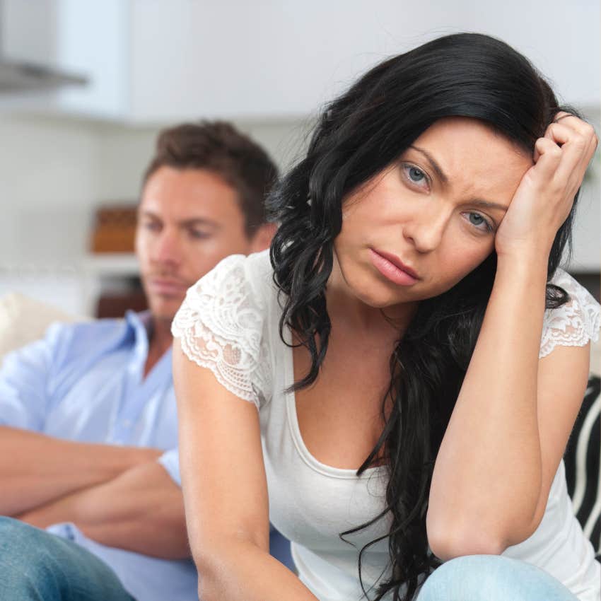 person who thinks they have bad luck looking sad by her boyfriend 