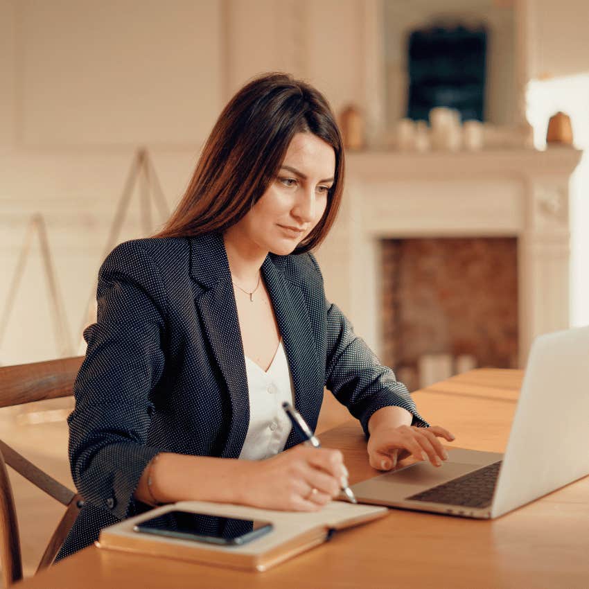woman cutting the fluff from their resume