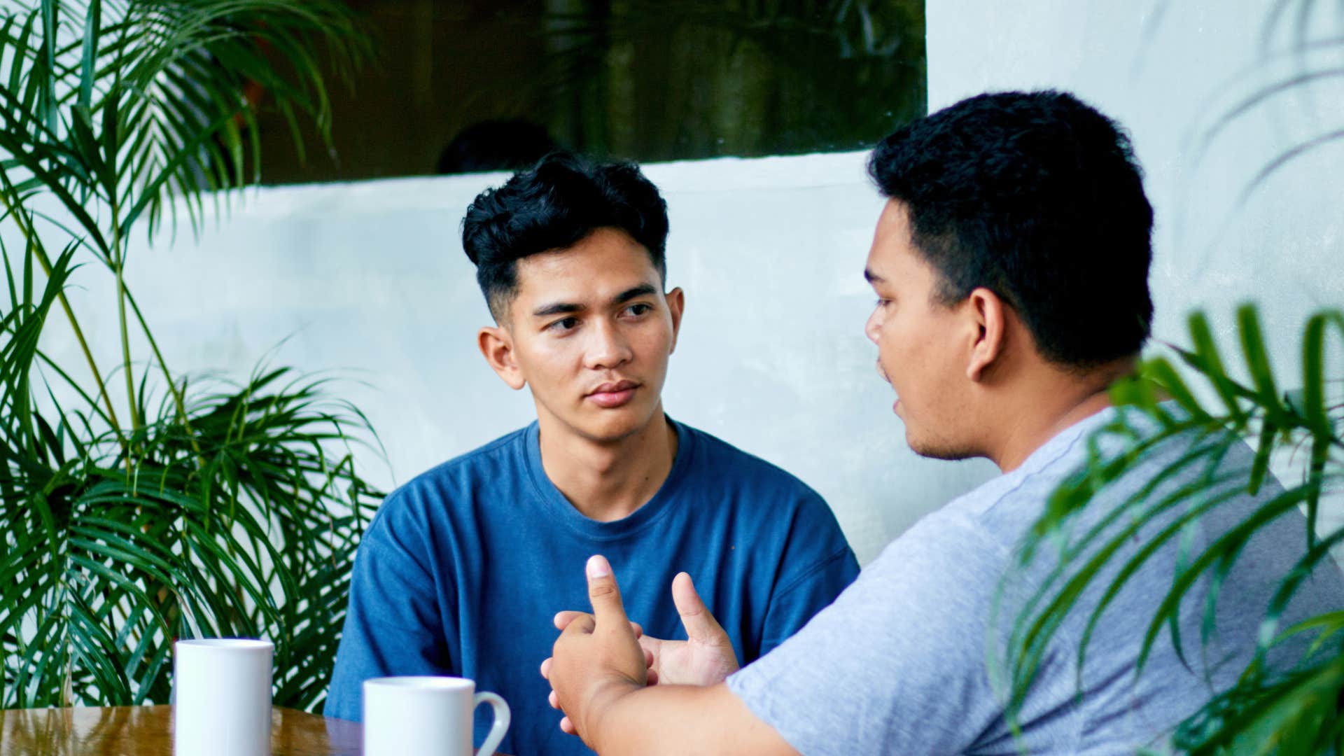 man telling his friend not to jump to conclusions