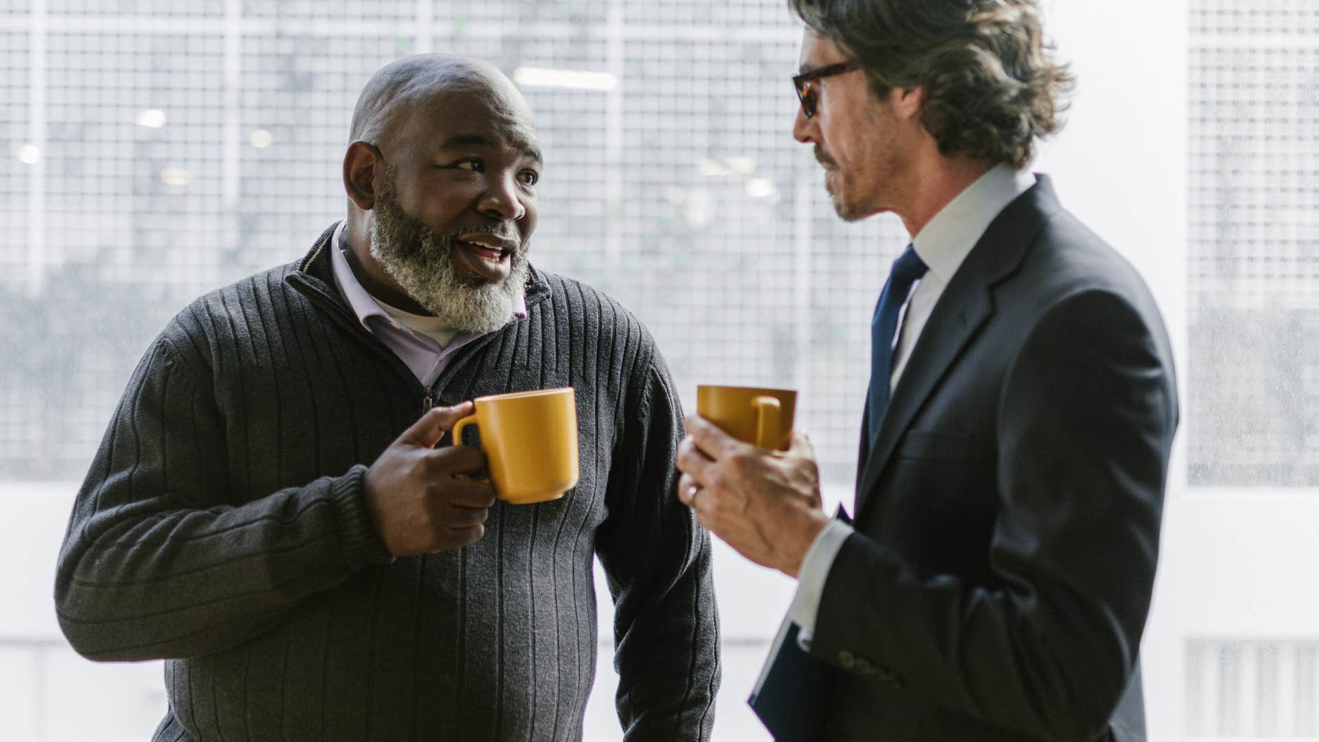 man telling a coworker he's not getting the point
