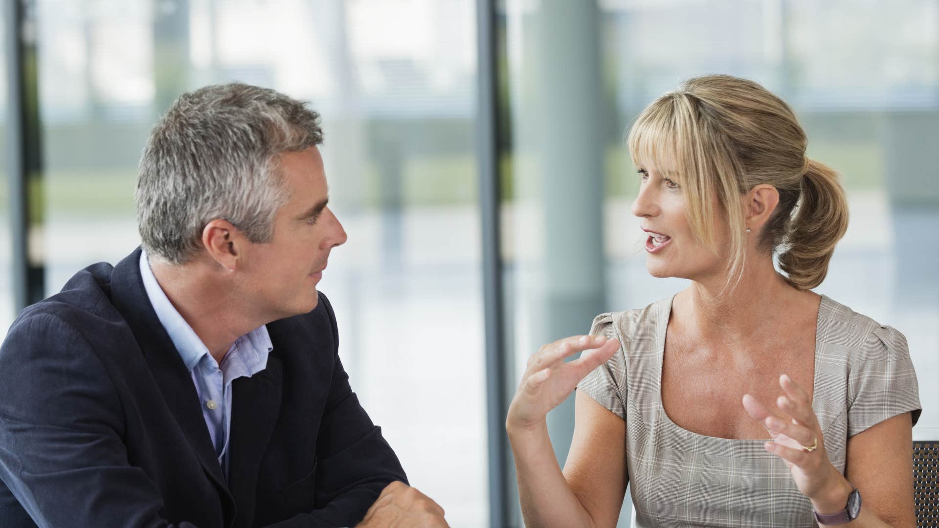 woman suggesting she and man she is talking to stop assuming